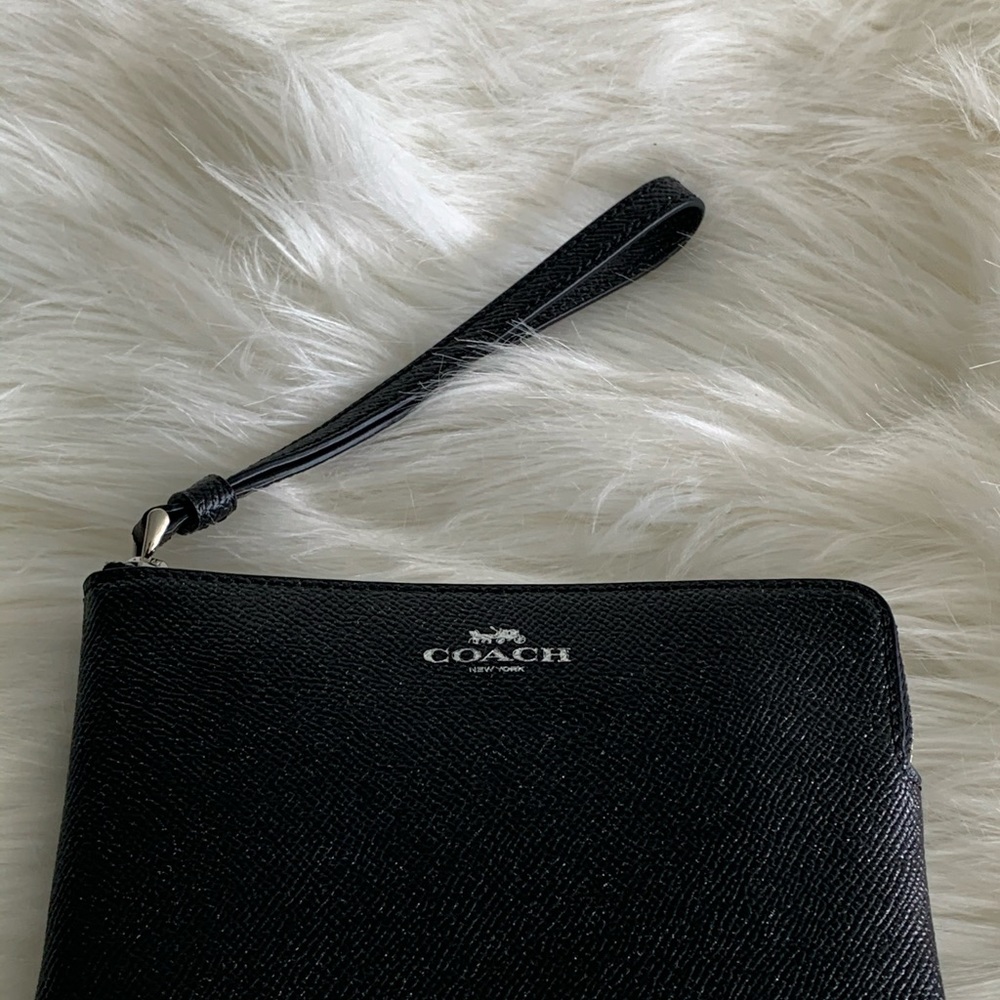 Coach wristlet in ebony shimmer.